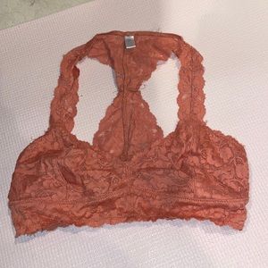 Burnt orange lace bralette. Size medium. NEVER WORN.